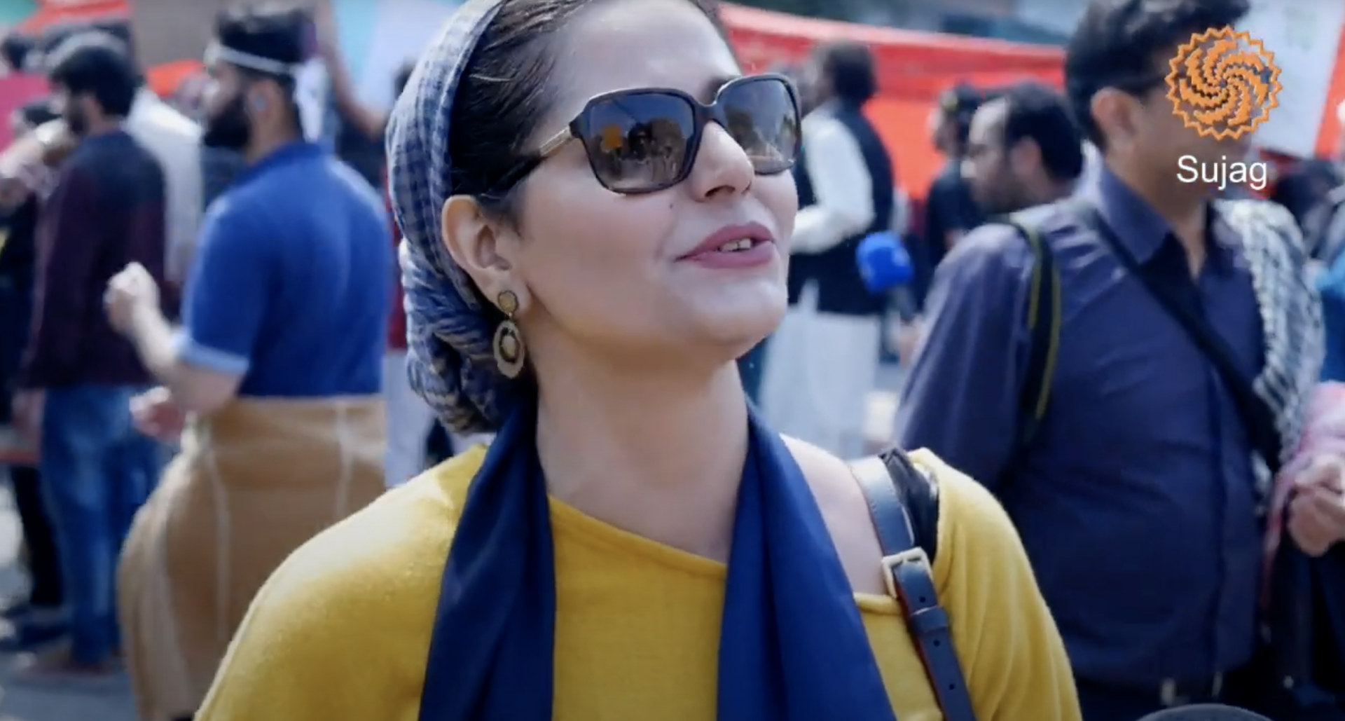 A Pakistani woman in sunglasses at the Aurat women's march