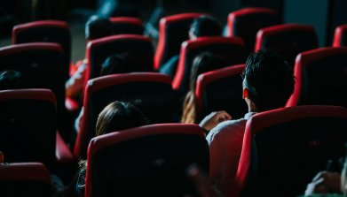 rear view asian chinese group of audience watching 3D movie in cinema enjoying the show with 3D glasses screaming excitement Movie theatre audience viewed from behind.